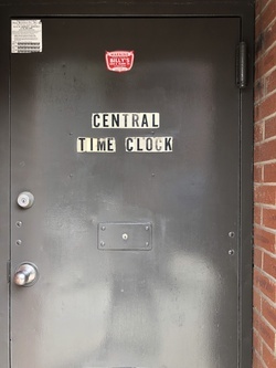 A photo shows slightly worn black letters on white stickers, adhered to an industrial metal door: CENTRAL TIME CLOCK. Behind it, an inventory of Electronic and Mechanical Time Clocks, Biometric HandPunches, and other systems promises to “effectively manage employees and control labor costs.” This is a contemporary archive of how time became a unit of extraction. Beginning with the mechanical watch, time was abstracted from natural rhythms and reoriented to discipline bodies—making labor measurable, predictable, and exchangeable. The punch clock institutionalized this shift: one punched in, one punched out—marking the boundaries of compensated life. In Total Running Time, this infrastructure of control becomes a site of inquiry.