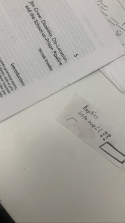 A photo shows a printed document titled “Jim Crow: Disability, Dis-Location, and the School-to-Prison Pipeline” placed beside a handwritten note reading, “haptics into wall??” accompanied by a small sketched rectangle. This image captures a moment in process—where research on the intersections of race, disability, and carcerality begins to shift toward a language of space and touch. It reveals a desire to make these systems not only visible but also felt, raising questions about how histories of exclusion and containment might be translated into touch.